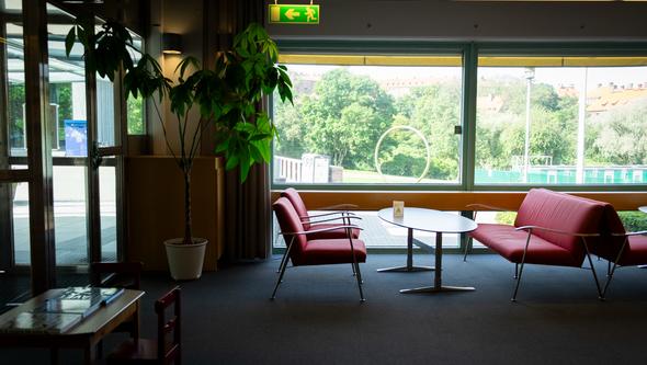Study areas to the left of the entrance with sofa settings.